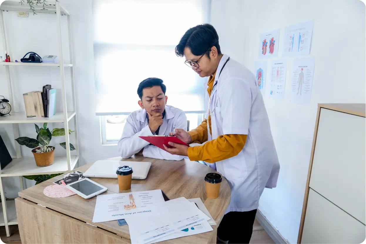 Medical professionals reviewing a treatment plan for an Intensive Outpatient Program (IOP) patient
