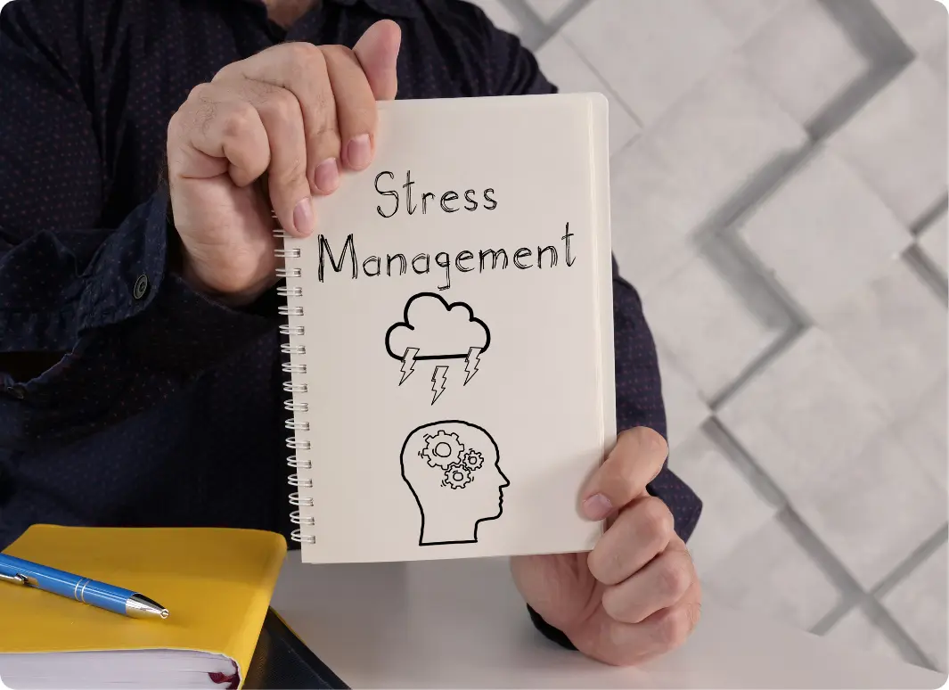Notebook labeled stress management representing therapy support in an Intensive Outpatient Program (IOP)