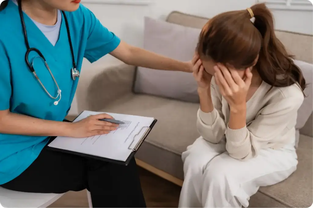 Therapist supporting a woman during an Intensive Outpatient Program (IOP) counseling session